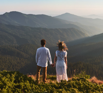 young-couple-love-standing-grassy-hill-mountains1